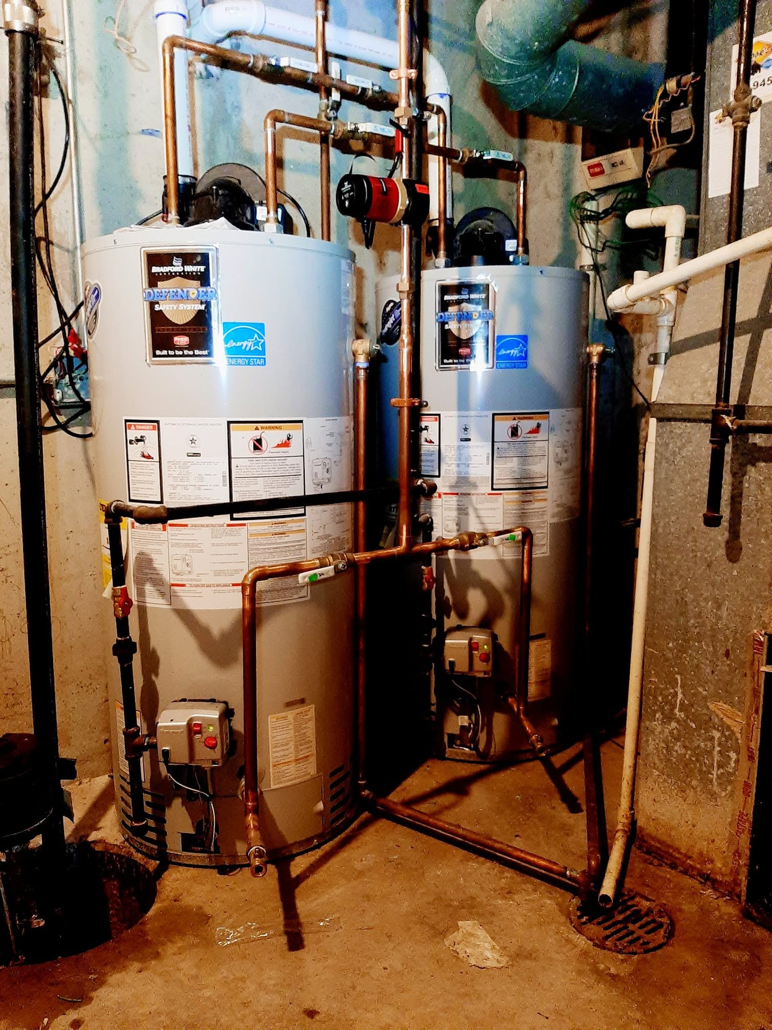 Two Bradford White water heaters piped in copper